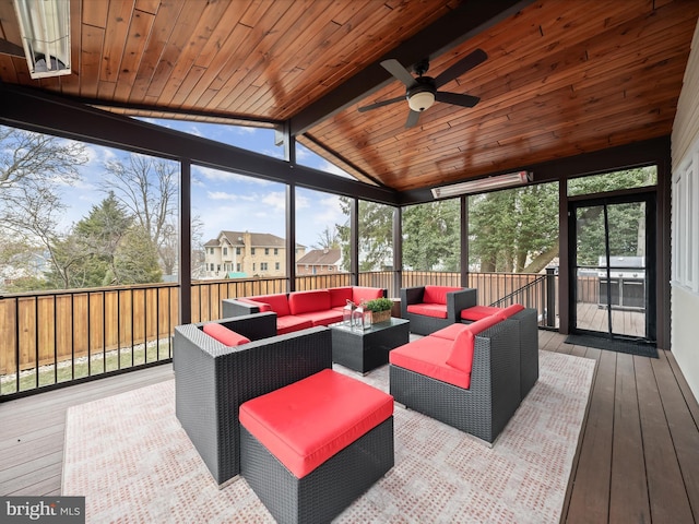 sunroom / solarium with vaulted ceiling with beams, ceiling fan, wood ceiling, and a wealth of natural light