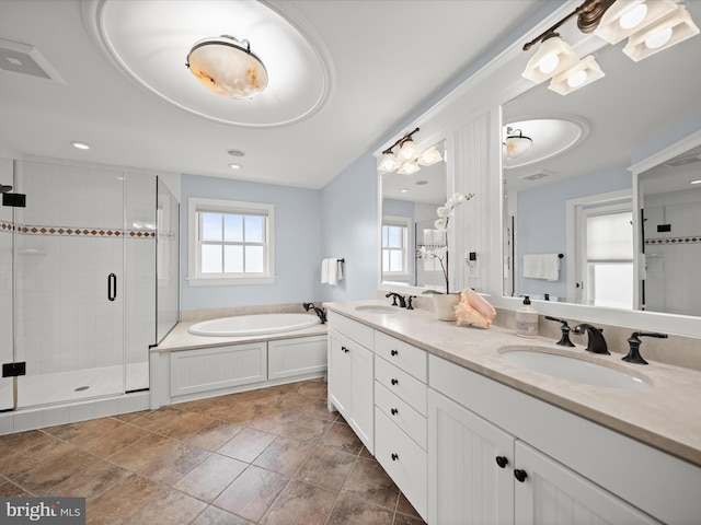 full bath with a bath, a wealth of natural light, a shower stall, and a sink