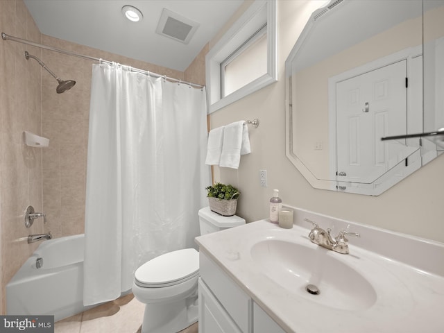 bathroom featuring toilet, shower / tub combo, vanity, and visible vents