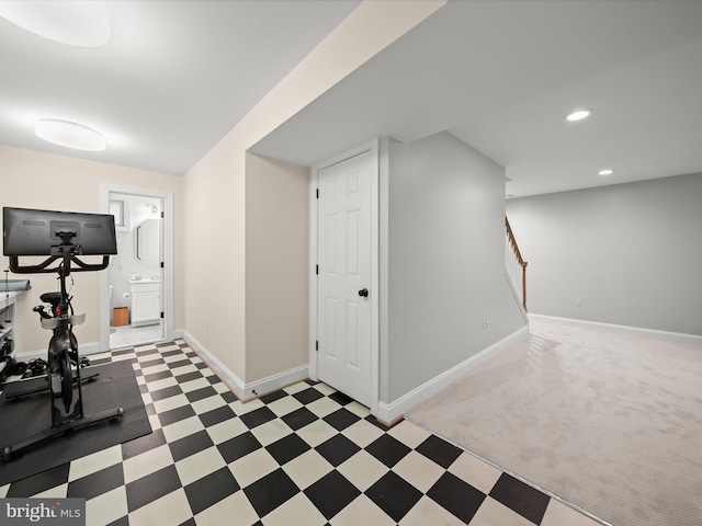 exercise area with tile patterned floors, baseboards, and recessed lighting