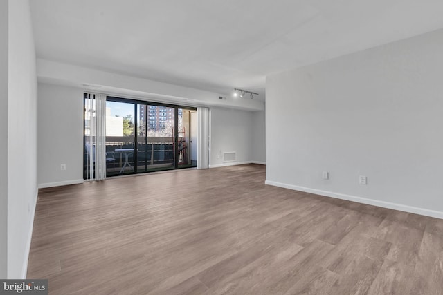 unfurnished room featuring light wood-type flooring