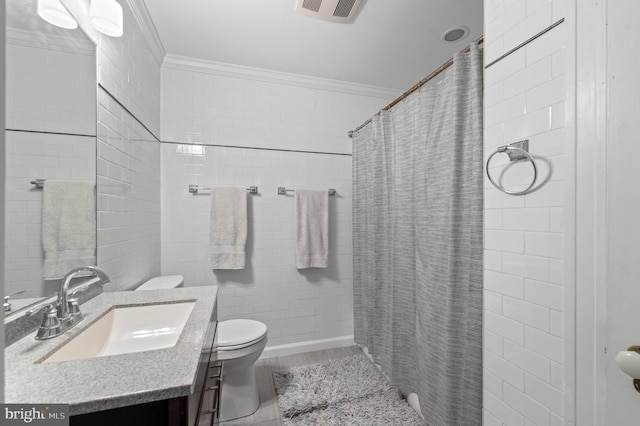 bathroom with visible vents, crown molding, vanity, and toilet