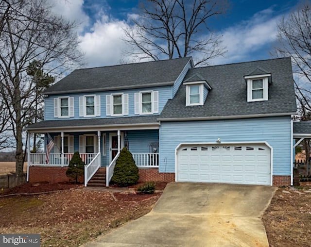 view of front facade featuring a garage, driveway, a porch, and roof with shingles