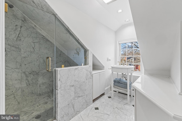 bathroom with lofted ceiling and an enclosed shower