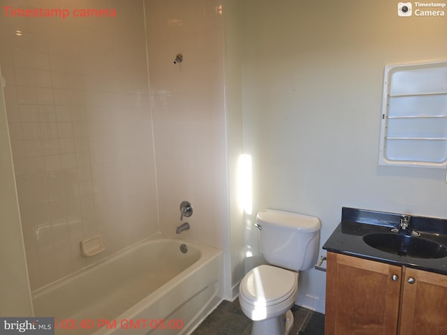 full bathroom with toilet, washtub / shower combination, baseboards, and vanity