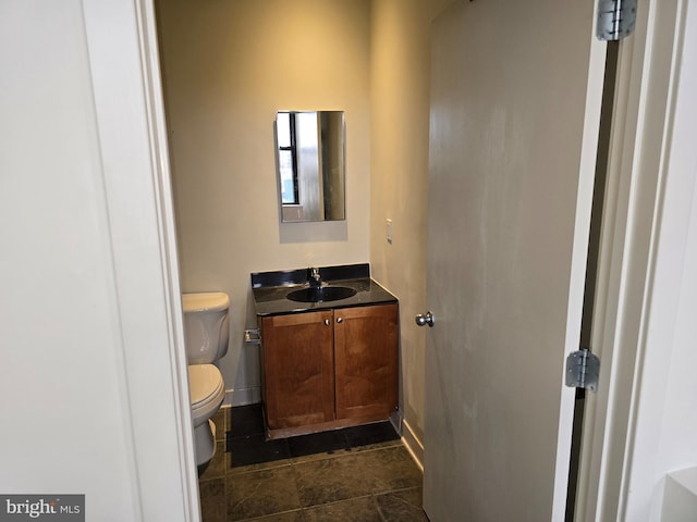 bathroom with toilet and vanity