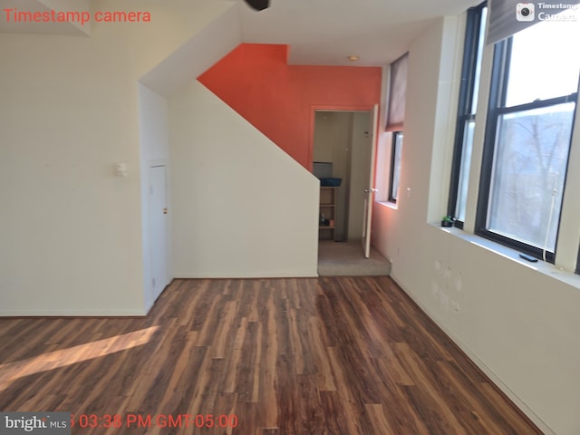 hallway with dark wood finished floors