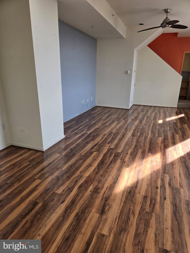 interior space with dark wood-style floors and a ceiling fan