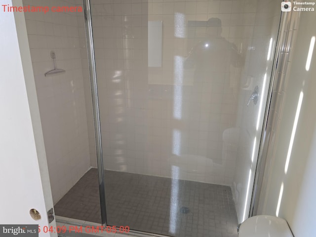 full bath with a shower stall