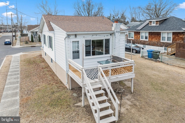 view of side of property with a lawn