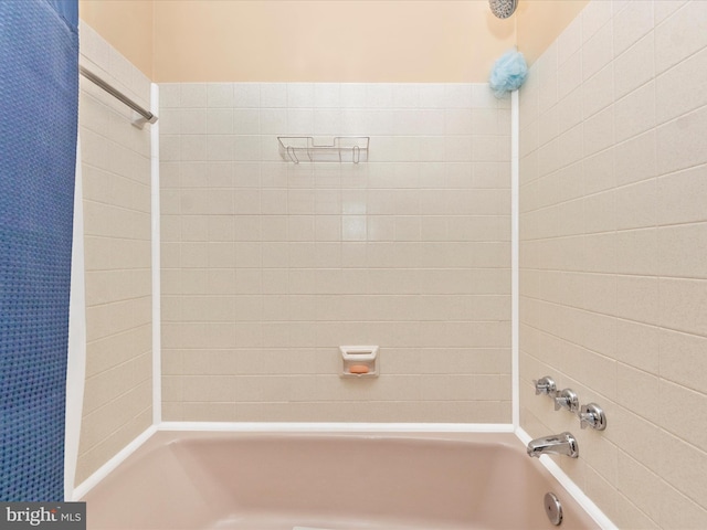 full bath featuring shower / tub combo with curtain