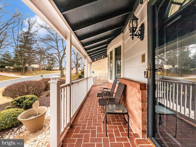 balcony featuring a porch