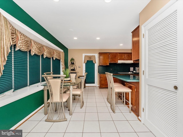 dining area with recessed lighting and light tile patterned flooring