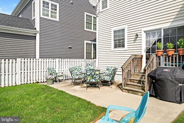 view of patio with a grill