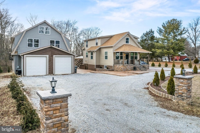 view of front of house featuring a garage and covered porch