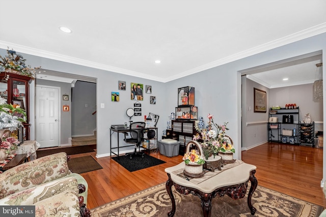 living room with ornamental molding, wood finished floors, and recessed lighting