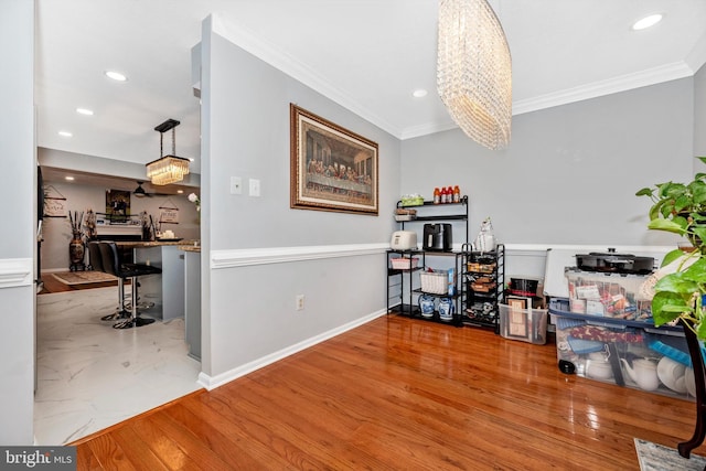 interior space featuring ornamental molding, recessed lighting, and wood finished floors