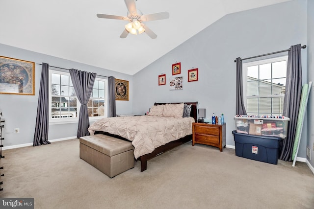 bedroom featuring lofted ceiling, baseboards, a ceiling fan, and light colored carpet