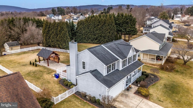 birds eye view of property featuring a residential view and a mountain view