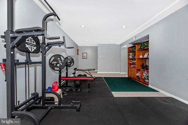 exercise room featuring baseboards and recessed lighting