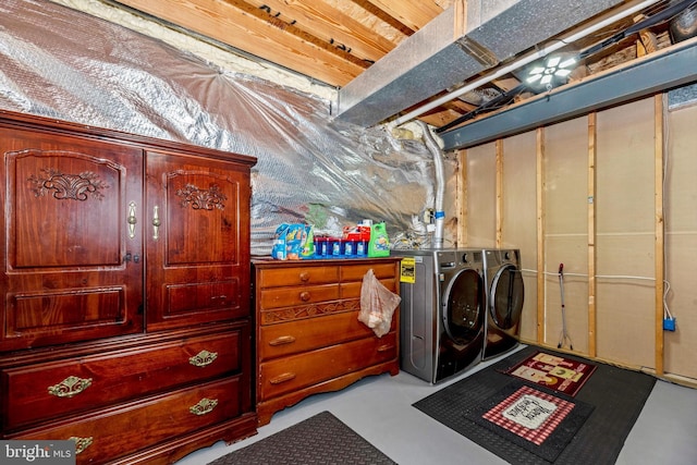 clothes washing area with laundry area and washer and clothes dryer