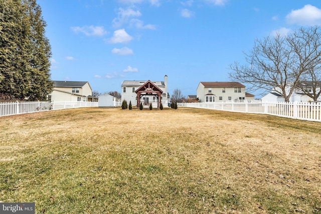 view of yard with a fenced backyard and a gazebo