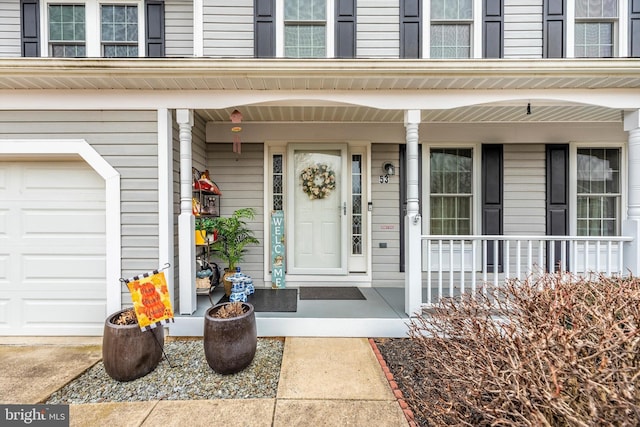 entrance to property featuring covered porch