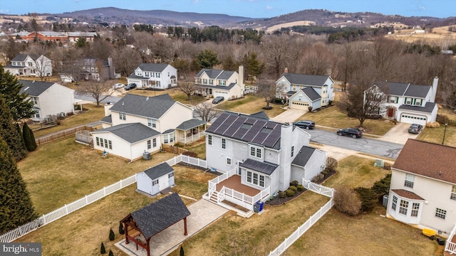 bird's eye view with a residential view and a mountain view