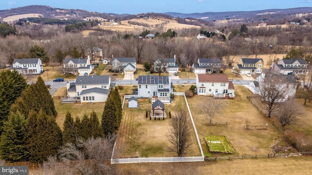 aerial view featuring a mountain view and a residential view