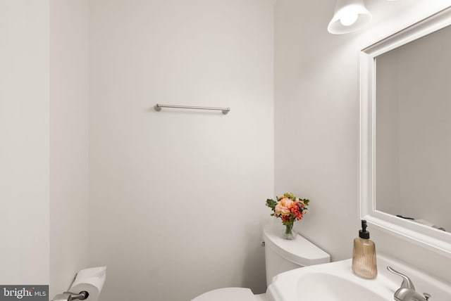 bathroom with a sink and toilet