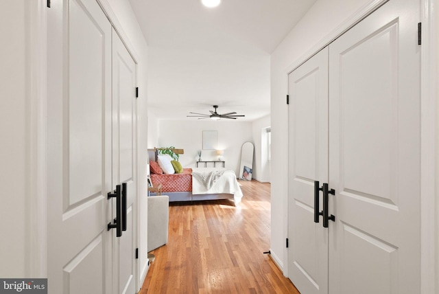 hallway with light wood-type flooring