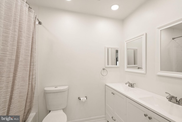 bathroom with toilet, shower / bath combo, a sink, and recessed lighting