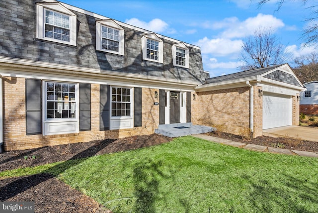 view of front facade featuring a front yard, brick siding, an attached garage, and roof with shingles