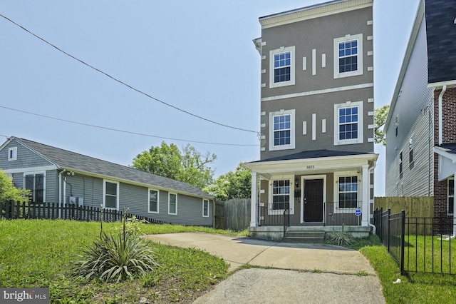 view of front of property with a front lawn and a porch