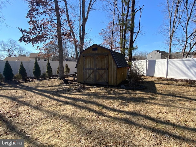 view of shed with a fenced backyard