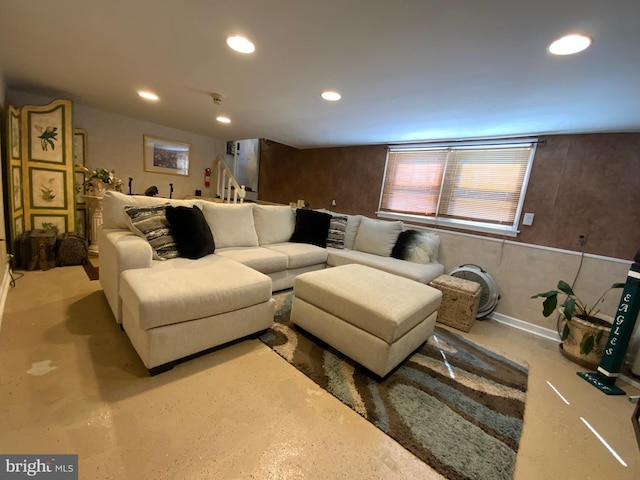 living room featuring recessed lighting and concrete floors