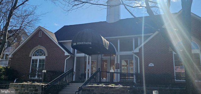 view of front of house featuring brick siding