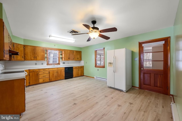 kitchen with brown cabinetry, white refrigerator with ice dispenser, light countertops, and dishwasher