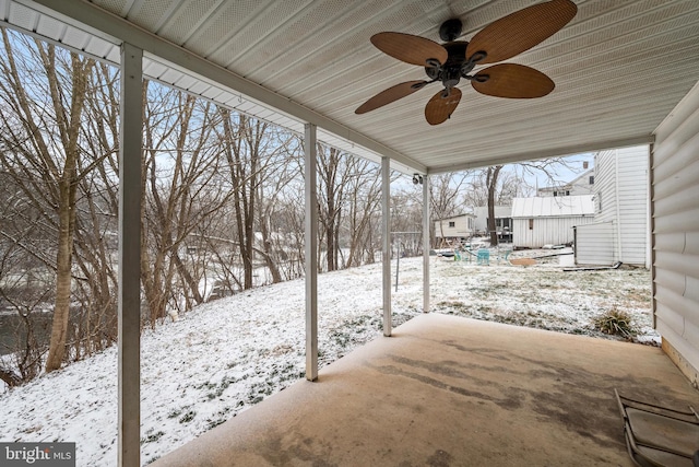 yard covered in snow featuring ceiling fan