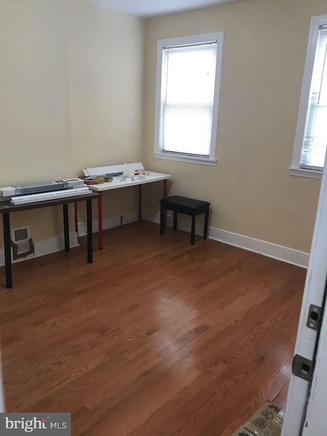 office space with dark hardwood / wood-style flooring