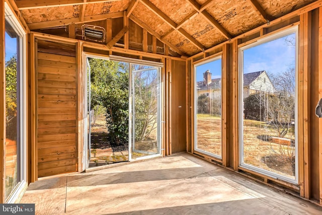 unfurnished sunroom featuring lofted ceiling