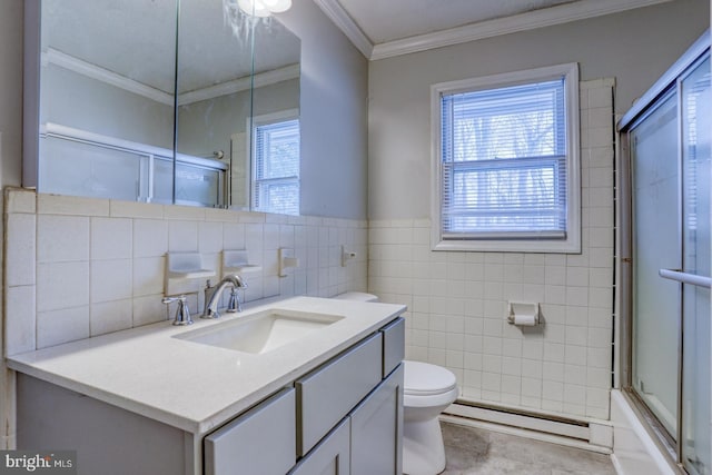 full bathroom with vanity, crown molding, toilet, baseboard heating, and shower / bath combination with glass door