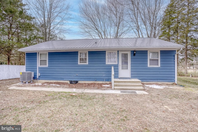 single story home featuring central AC unit