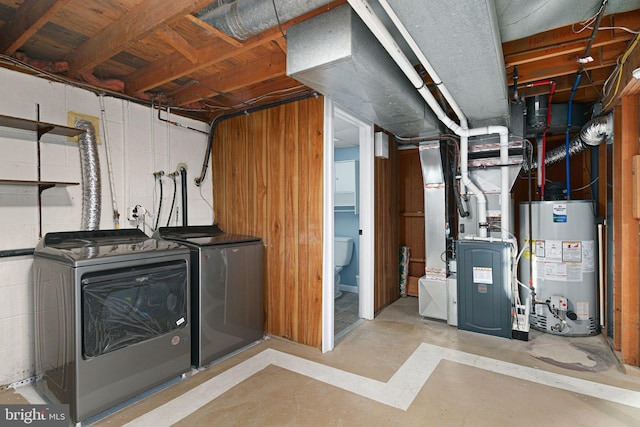 basement with independent washer and dryer and water heater