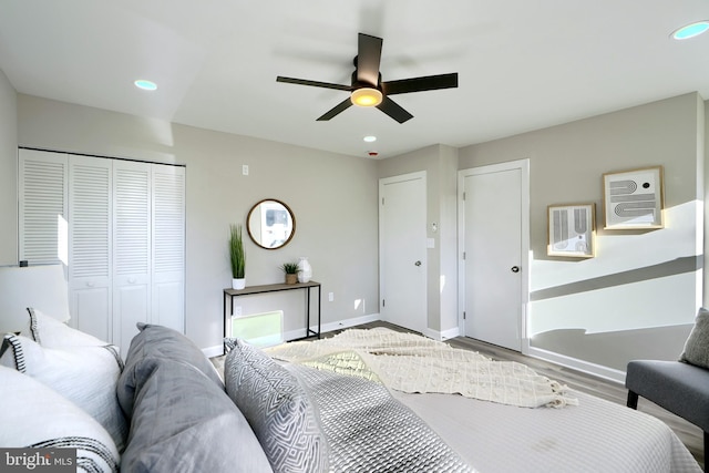 bedroom featuring a closet, ceiling fan, and wood-type flooring