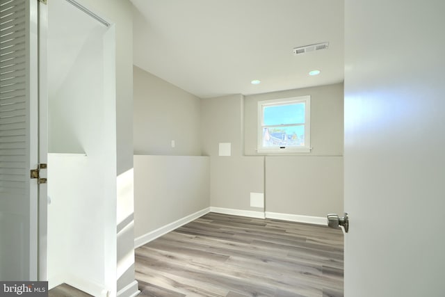 empty room featuring hardwood / wood-style flooring