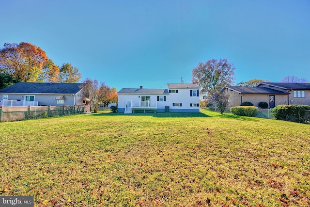 back of house with a yard