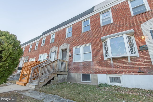 townhome / multi-family property with brick siding