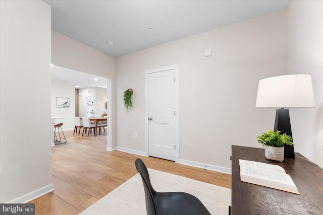 office area with wood finished floors and baseboards