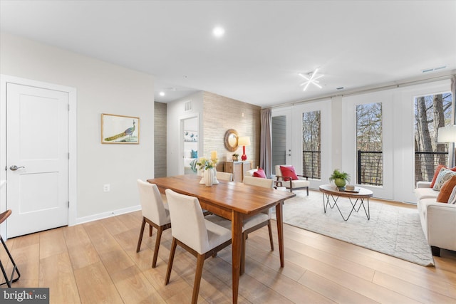 dining space with baseboards, recessed lighting, visible vents, and light wood-style floors